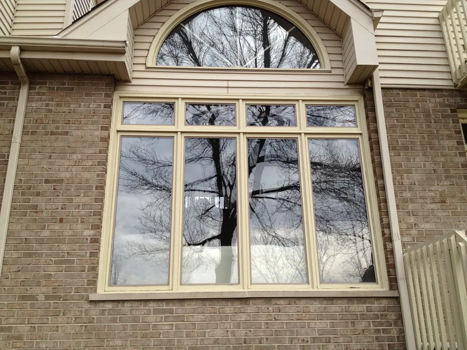 Arched specialty window on a Chicagoland home — an Excel install