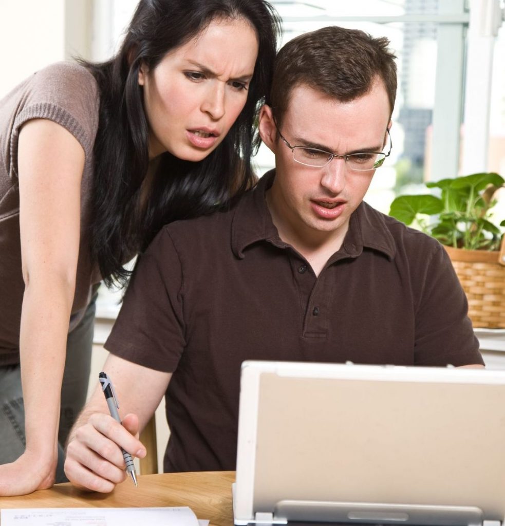 couple stressed over Monthly Utility Budget